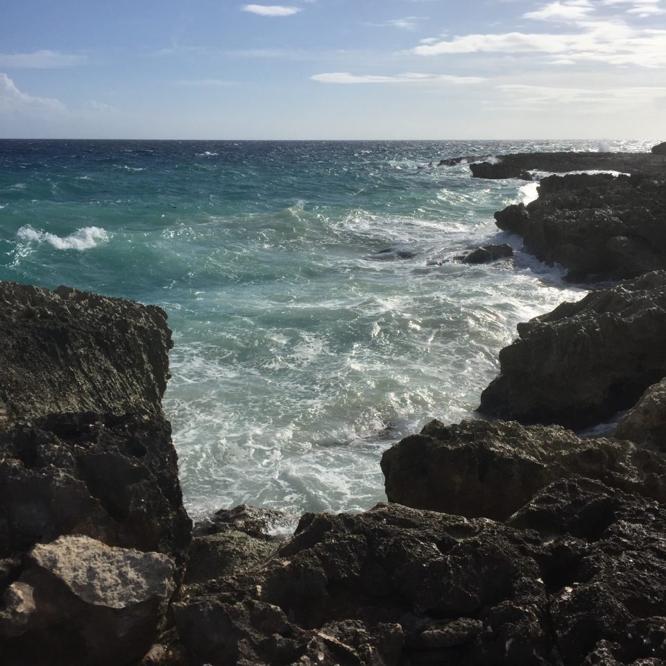 crashing ocean waves all inclusive resort in Negril, Jamaica